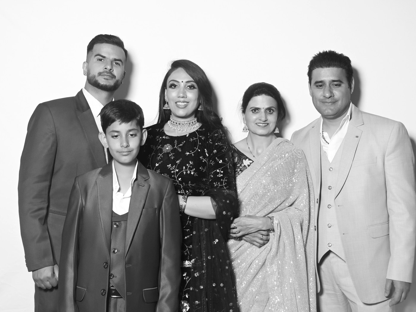 Family dressed for a wedding, black and white portrait